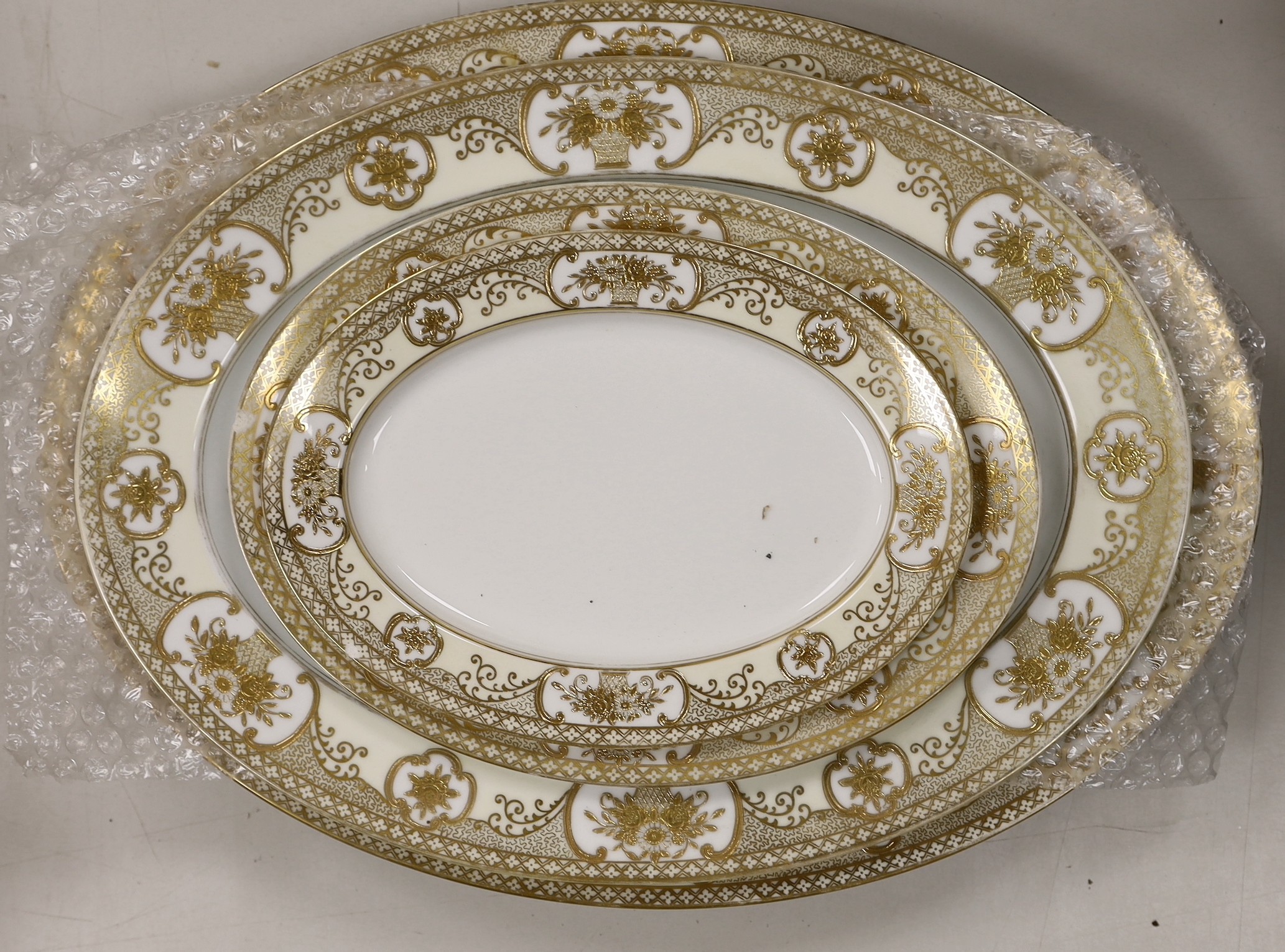 A Noritake gilt bordered dinner service